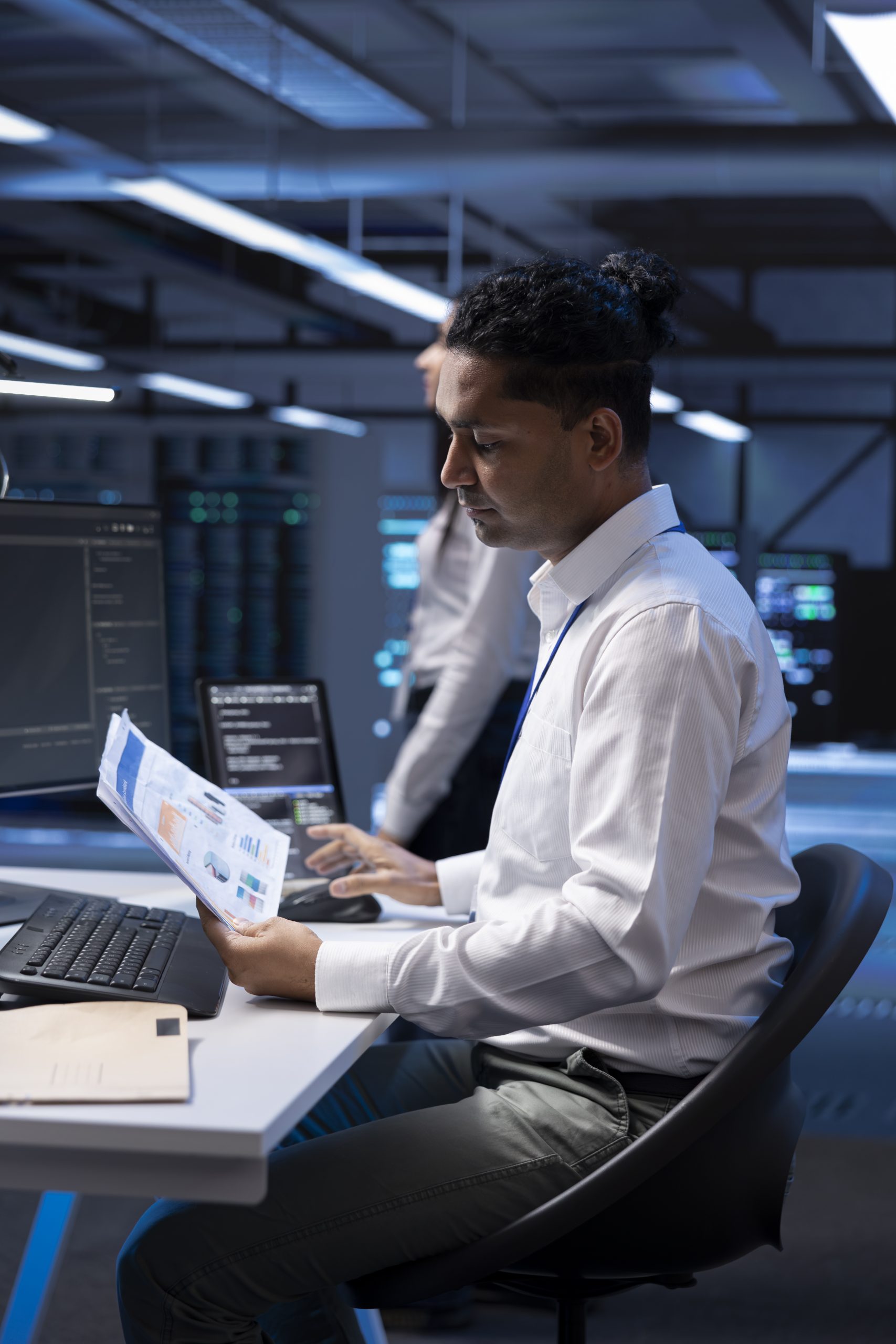 A man at a desk with a laptop, showcasing Managed IT Services Knoxville for secured IT solutions and cybersecurity.